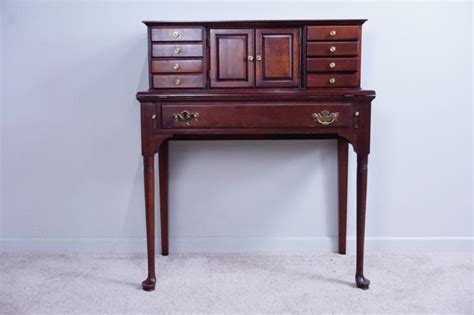 Monroe 54 writing desk.two tone desktop, with dark cherry finish border and light cherry inlay.dark and light cherry finish.elegant tapered legs.durable laminate finish.spacious center drawer with. PENNSYLVANIA HOUSE SOLID CHERRY WRITING DESK