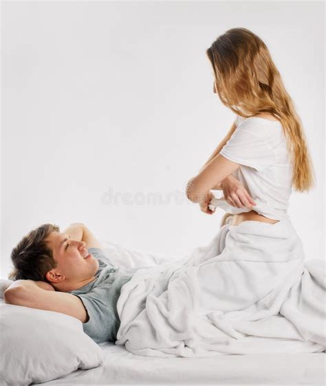 Woman Undressing In Bed With Her Boyfriend Stock Photo Image Of