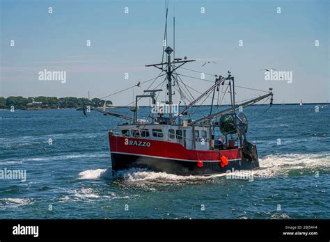 A Fishing Vessel Returning Home From Sea Enters Gloucester Harbor Along