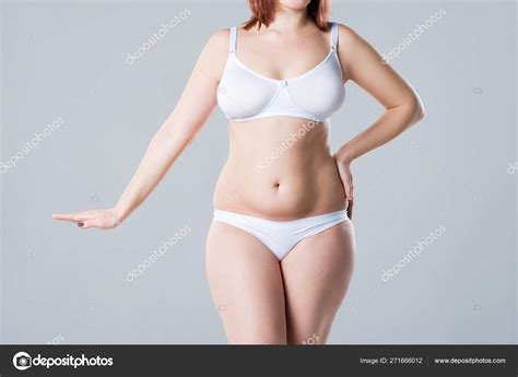 Woman With Fat Flabby Belly Overweight Female Body On Gray Background Stock Photo By Starast