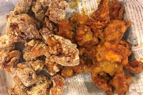 Korean fried chicken is sweet, sticky, and crispy—everything you'd want in wings. NYC - KTown Pelicana - White Snowing Cheese and Spicy ...