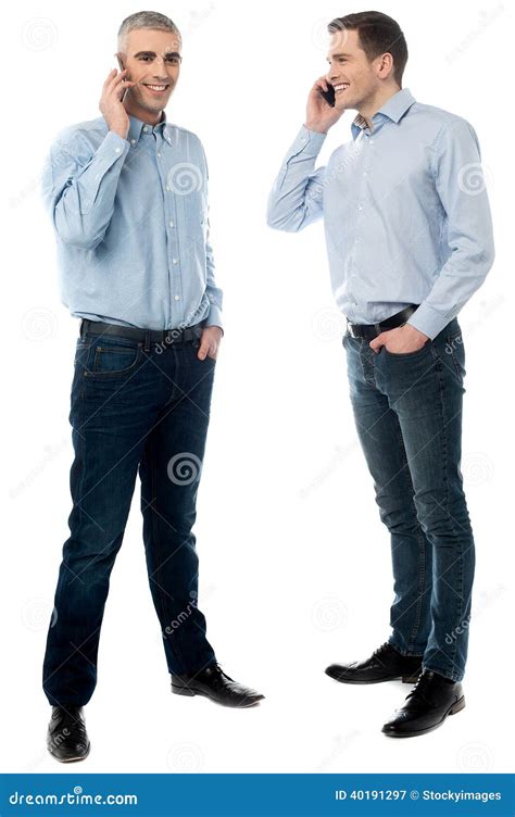 Two Young Men Talking Through Mobile Phone Stock Image Image Of