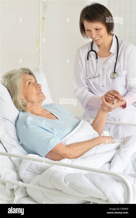 Mature Woman In Hospital Bed Smiling Hi Res Stock Photography And