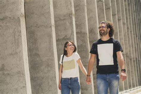 Couple Walking Down The Street And Holding Hands Stock Photo Image Of