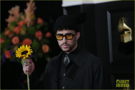 Bad Bunny Holds Up A Sunflower At Grammys 2021 Red Carpet Photo