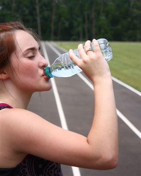 Water Exercise Free Stock Photo A Cute Young Girl Drinking Water On