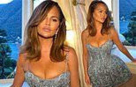 Chrissy Teigen Puts On A Busty Display In A Stunning Blue Embroidered