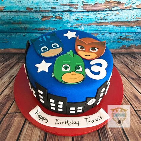 A Birthday Cake With Three Cartoon Characters On The Top And Number 3