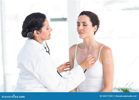 Doctor Listening To Patients Chest With Stethoscope Stock Photo Image