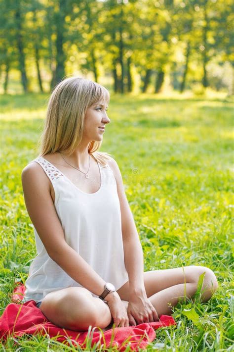 Young Woman Sitting On The Grass Stock Image Image Of Body