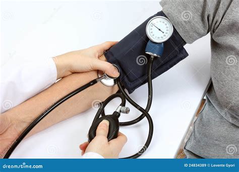 Doctor Checking Blood Pressure With Stethoscope Royalty Free Stock