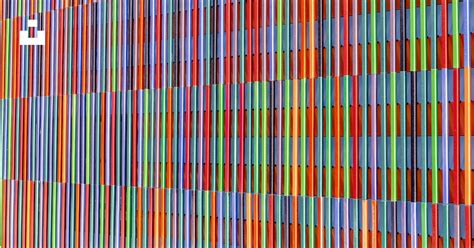 A Multicolored Wall Is Shown With Vertical Lines Photo Free