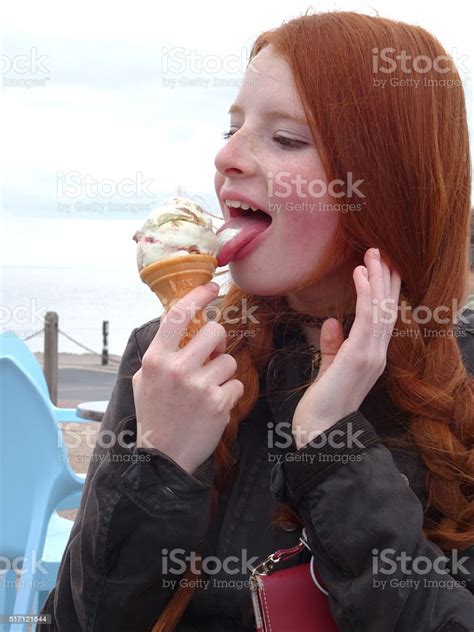 Image Of Teenage Girl Licking Melting Ice Cream Cone Seaside Stock