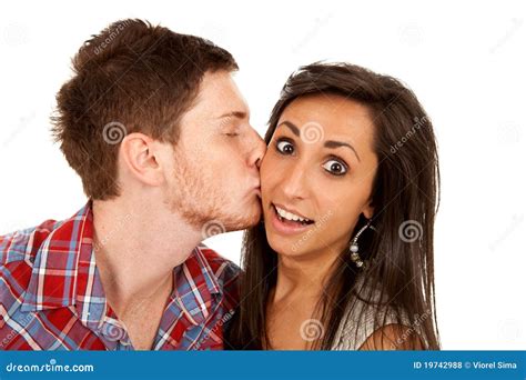 Woman Kisses Her Boyfriend On The Cheek Stock Photo Image Of White Amazed