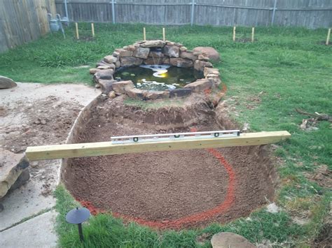 Dig the pond to the desired shape and dig a shelf around the perimeter of the pond about one foot deep and one or more feet wide. Add the Natural Beauty of Nature to your Home by Adding a ...