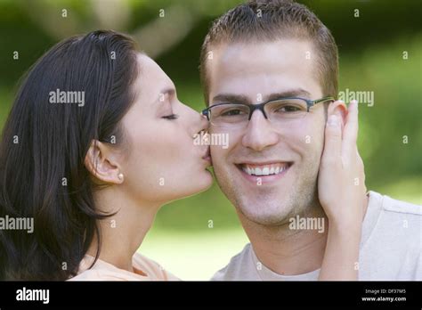 Guy Gets Kiss From Beautiful Woman Stock Photo Alamy