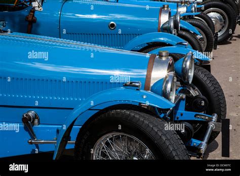 A Row Of French Racing Blue Bugatti Type 37 Classic Racing Cars In