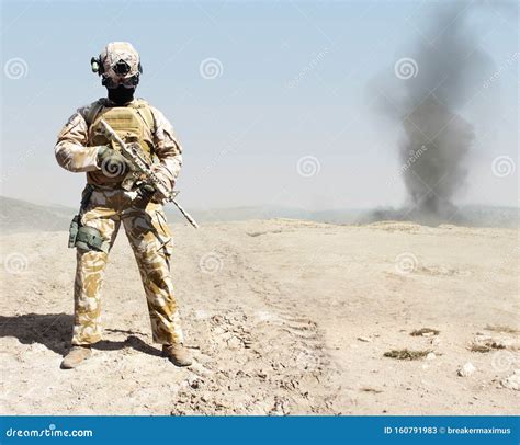 Desert Soldier Standing Armed In Desert War Background Stock Image