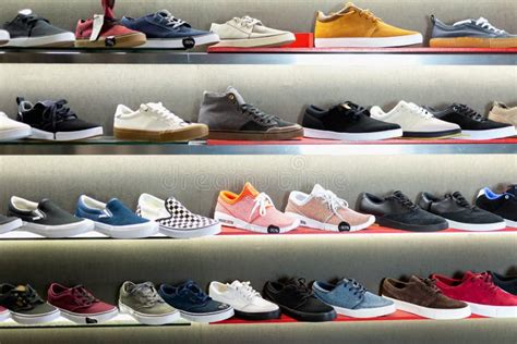 A Lot Of Casual Men Shoes On Shelves In Shoe Store Editorial Stock