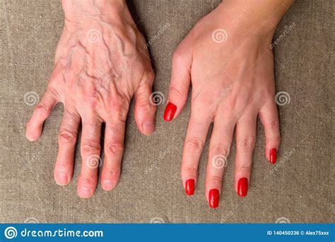 The Hands Of A Young And Elderly Women Stock Photo Image Of White