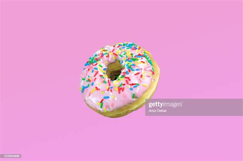 Pink Donuts With Colorful Toppings High Res Stock Photo Getty Images