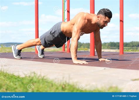 Focused Muscular Guy Doing Plank Exercise Outdoors Stock Image Image