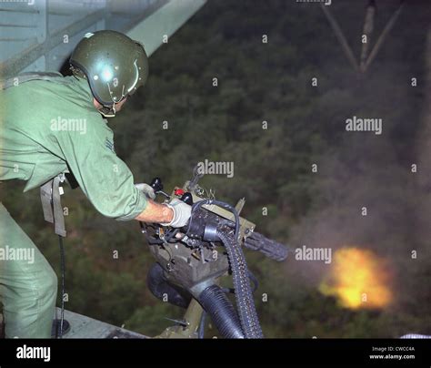 Vietnam War Us Air Force Helicopter Door Gunner Fires A Mini Gun