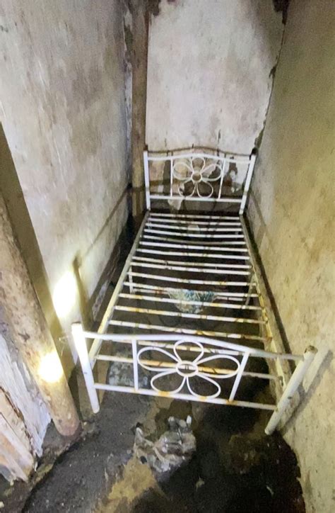 Couple discover 'freaky' hidden room behind bathroom wall