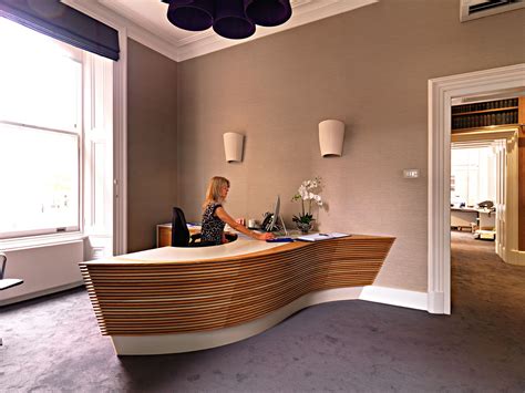 Bespoke Curved Reception Desk From Solid Oak And Corian Top Surface