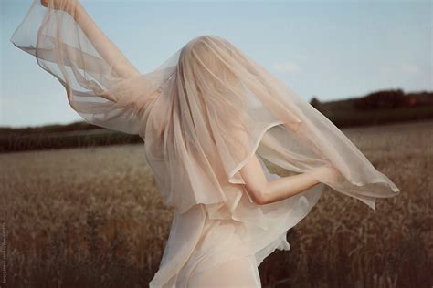 Woman In Transparent Dress And Veil Dancing Outdoor By Stocksy