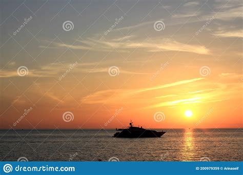 Yacht Sailing On The Sea With A Beautiful Sunset Stock Image Image Of