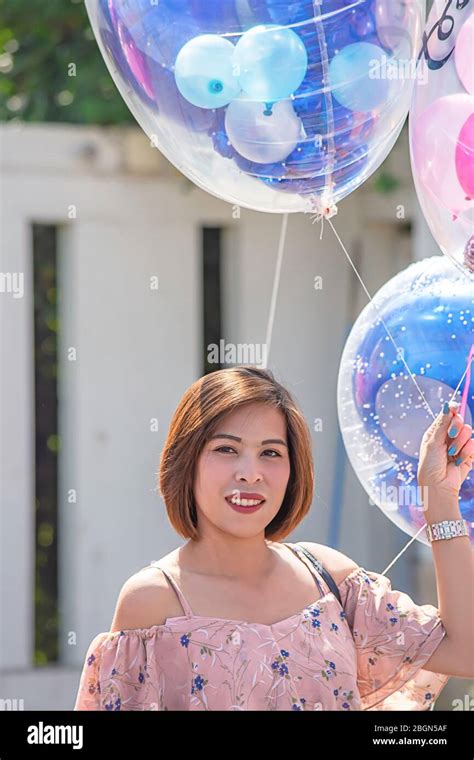 Asean Women Are Holding A Balloon In Hand Stock Photo Alamy