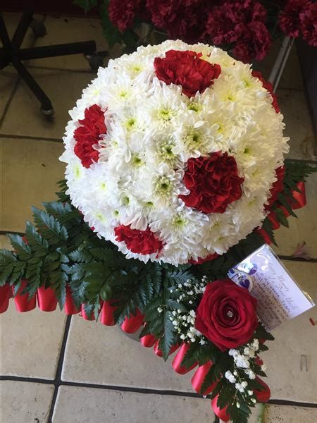 Floral wreaths for a spring funeral. Football on a Pitch - Funeral Flowers Liverpool