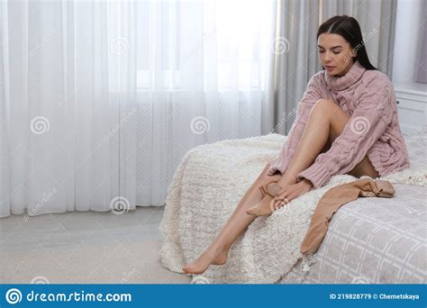 Woman Wearing Compression Tights On Bed Indoors Space For Text Stock