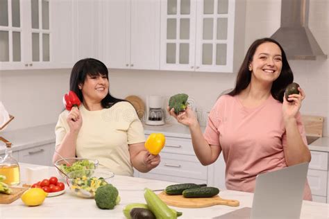 Happy Overweight Women Having Fun While Cooking Together In Kitchen Stock Image Image Of