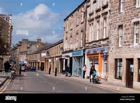 Scotland Elgin Pedestrians And Road Through Town Centre Stock Photo