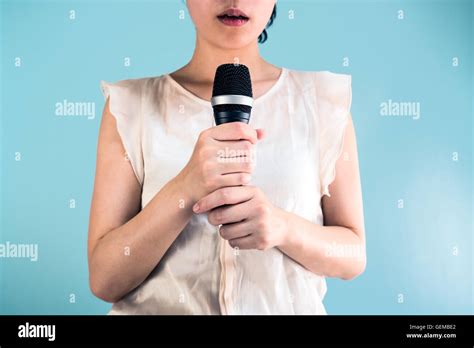 Woman Holding Microphone Stock Photo Alamy