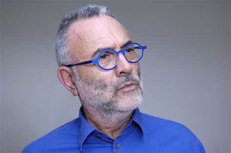 Premium Photo Man In Glasses And Blue Shirt Staring