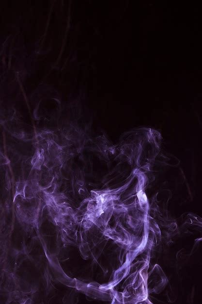 Free Photo Realistic Purple Smoke Waves Isolated On Black Background