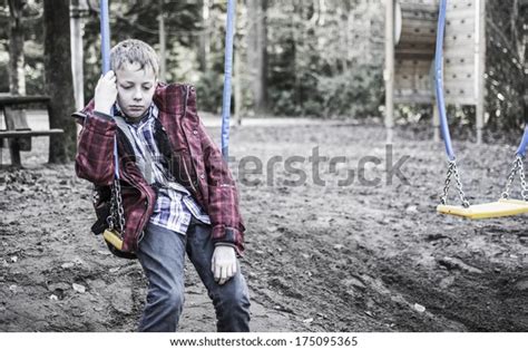 Sad Lonely Boy Sitting On Swing Stock Photo Edit Now