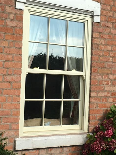 Upvc Vertical Sliding Sash Window In Cream With Authentic Plant On