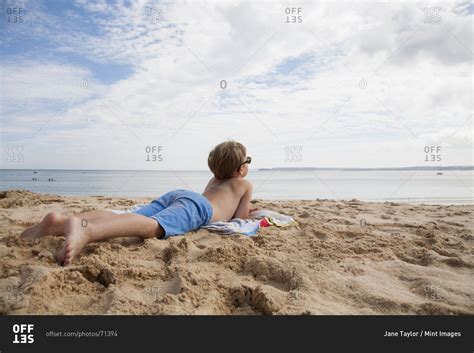 Babe Babe Sunbathing On The Beach Stock Photo OFFSET