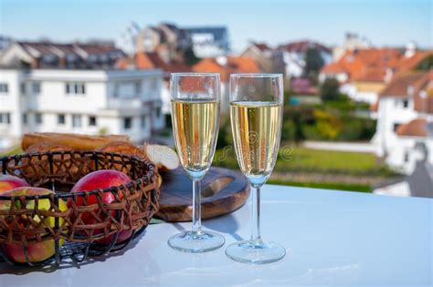 Drinking Of Brut Champagne Sparkling Wine In Flute Glasses On Outdoor