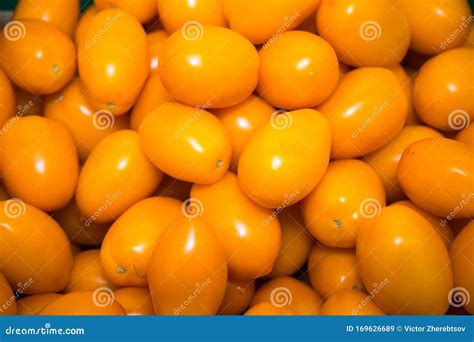 Fresh Bright Plum Shaped Orange Tomatoes In Bulk Vegetables Fruits