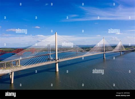 Aerial View Of Three Bridges Crossing The River Forth With New