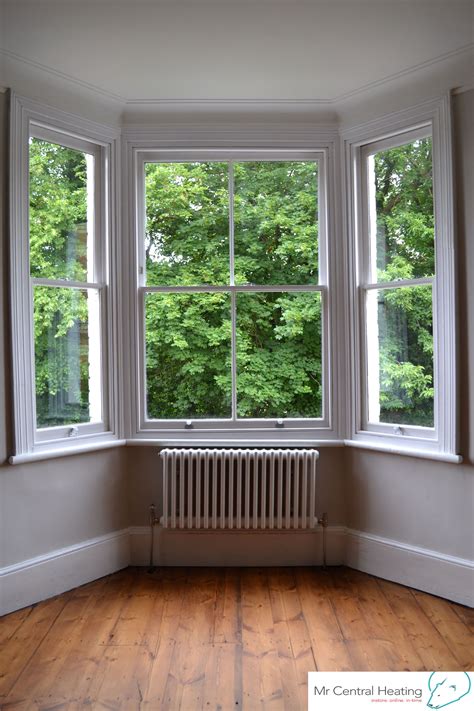 White Column Radiator Is A Beautiful Addition To This Bay Window Bay