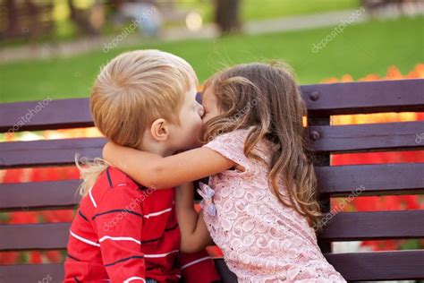 Love Concept Couple Of Kids Kissing Stock Photo By ©vitalinka 30099255