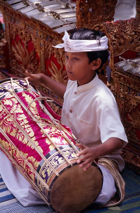 A Balinese Boy Plays A Drum In A Childrens Gamelan Orchestra At A