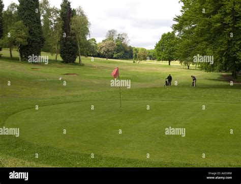 Two Men Playing Pitch And Putt Golf In The Grounds Of Woodthorpe Grange