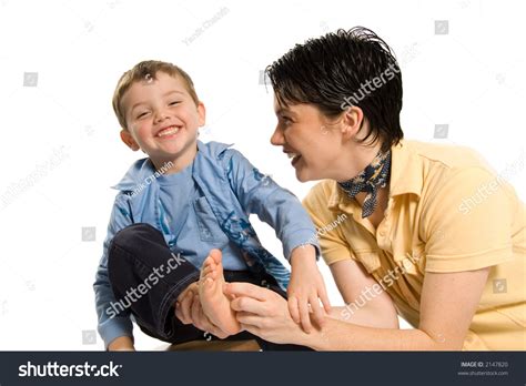 Mom Tickling Sons Feet On White Stock Photo Shutterstock